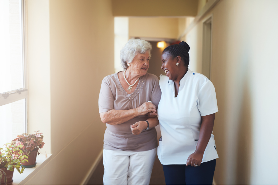 Enrogel staff and resident laughing and bonding.